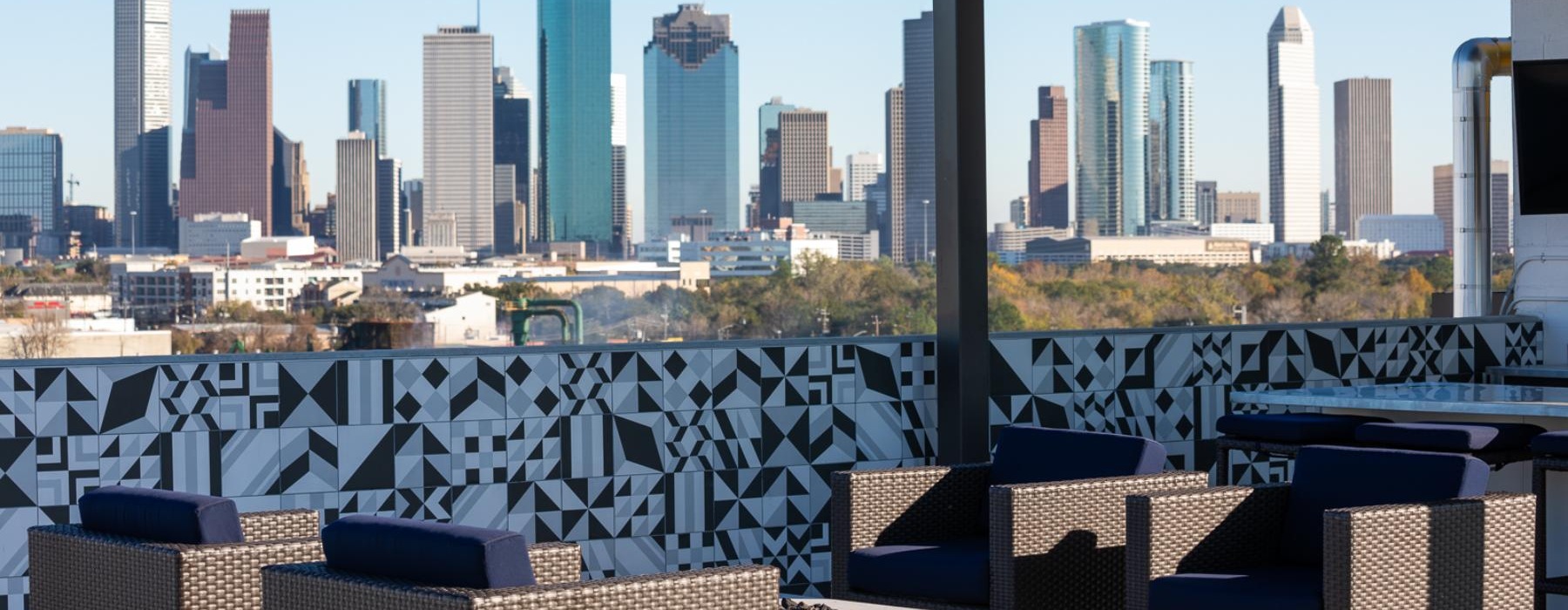 a lounge area with chairs and a city skyline
