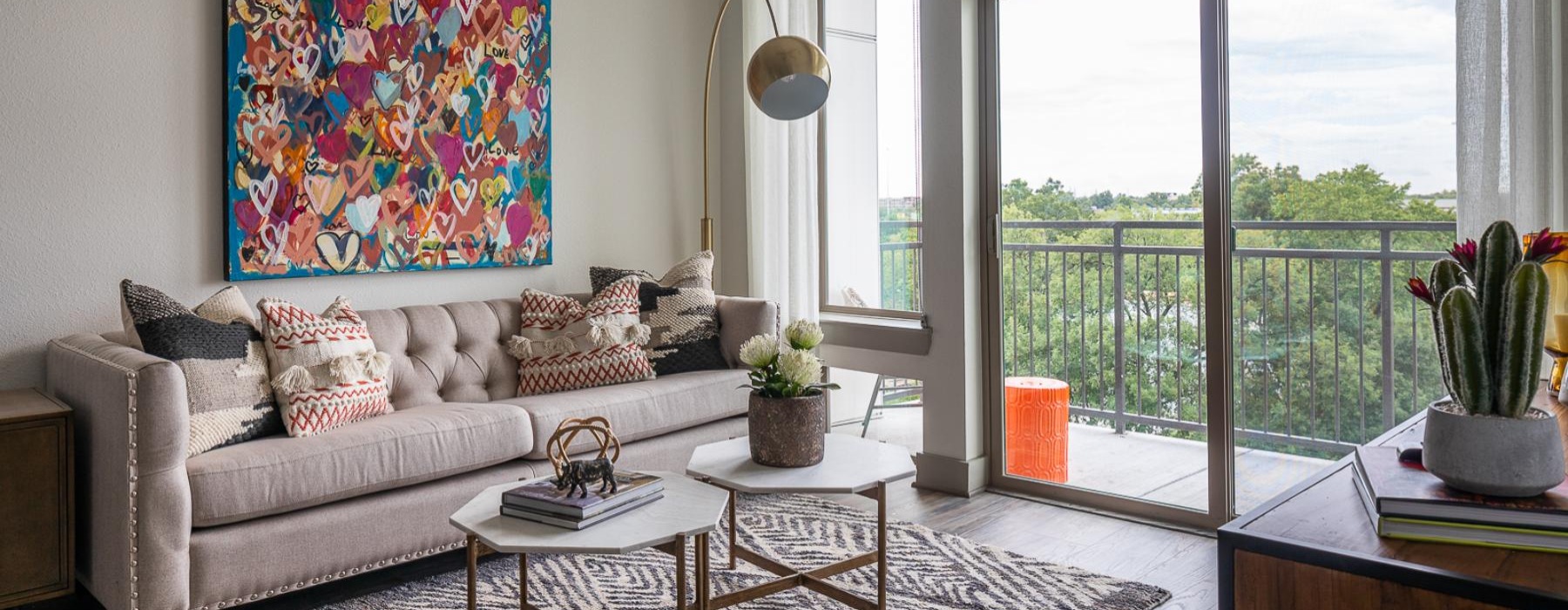 a living room with a couch and a large window