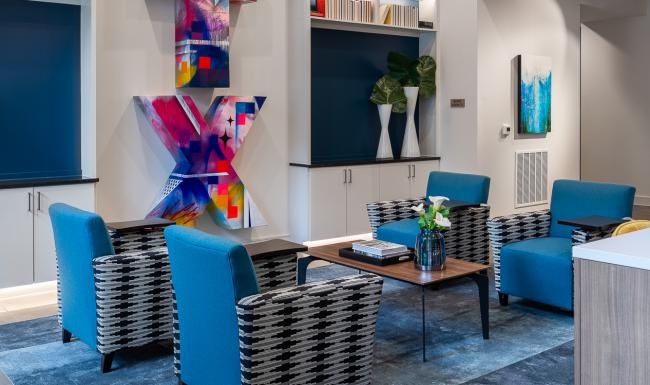 a clubroom with chairs and a table